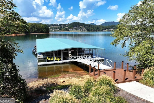 dock area featuring a water and mountain view