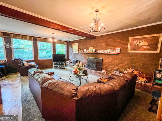 living room with carpet flooring, a brick fireplace, brick wall, an inviting chandelier, and crown molding