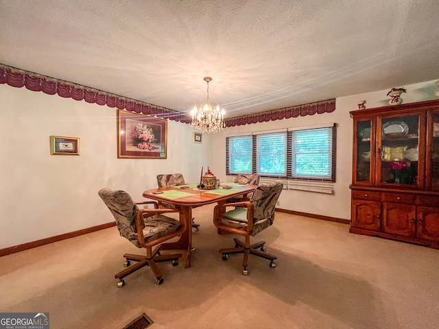 carpeted dining area featuring a notable chandelier and a textured ceiling