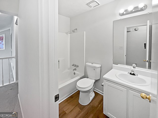 full bathroom featuring vanity, bathtub / shower combination, toilet, and hardwood / wood-style flooring