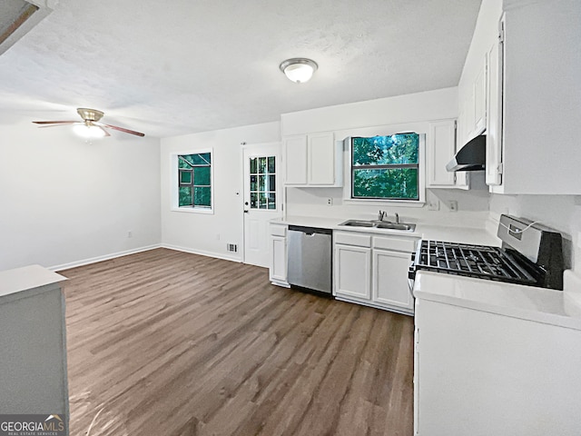 kitchen featuring white cabinets, dishwasher, wood-type flooring, stove, and ceiling fan