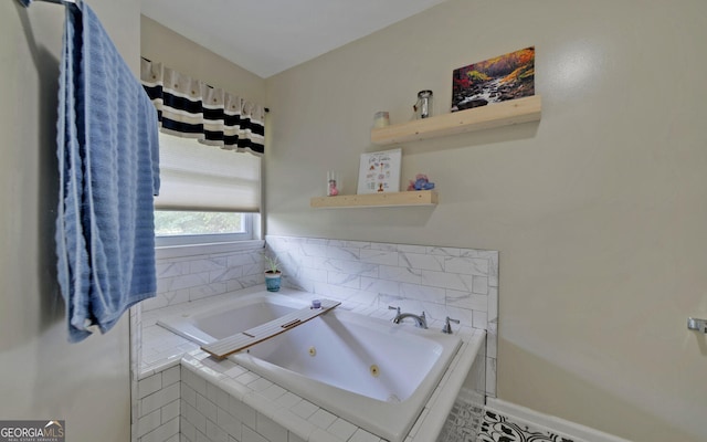 bathroom featuring tile patterned flooring and tiled bath