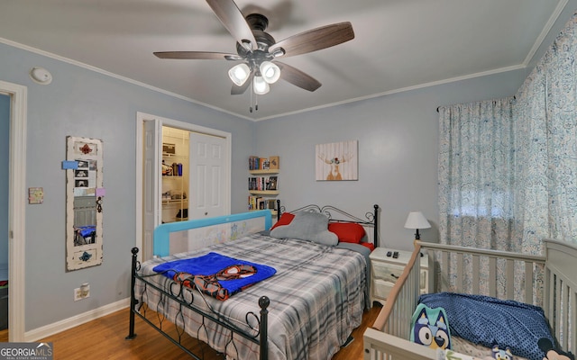 bedroom with ceiling fan, hardwood / wood-style flooring, and ornamental molding