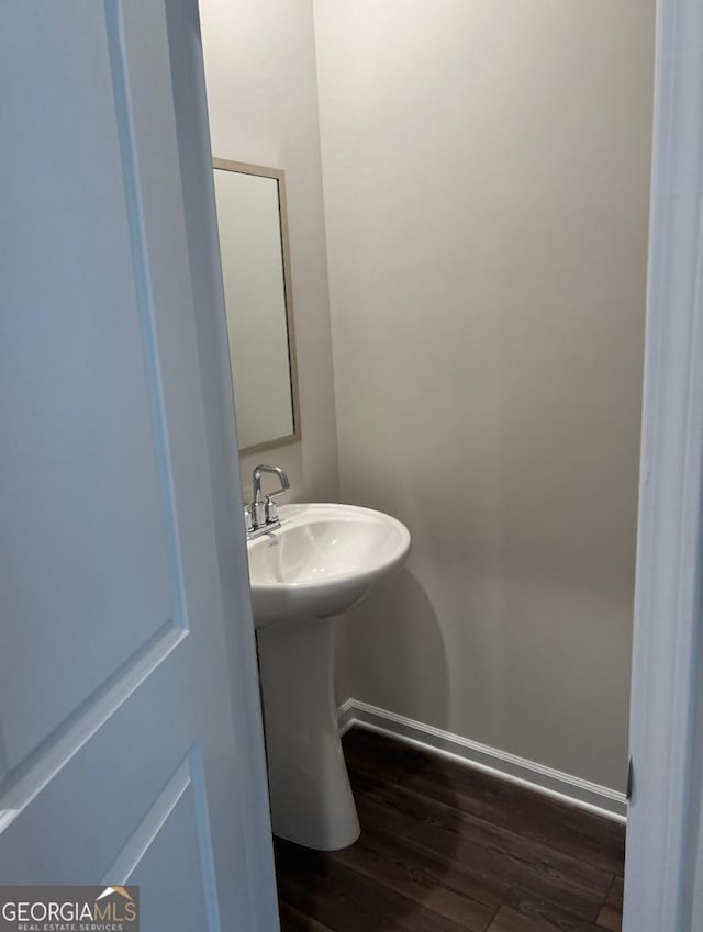 bathroom featuring wood-type flooring