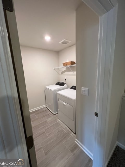 laundry area featuring separate washer and dryer