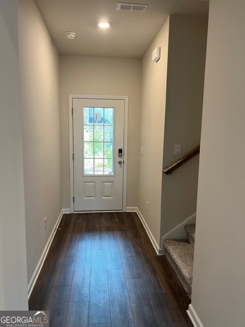 entryway with dark hardwood / wood-style floors