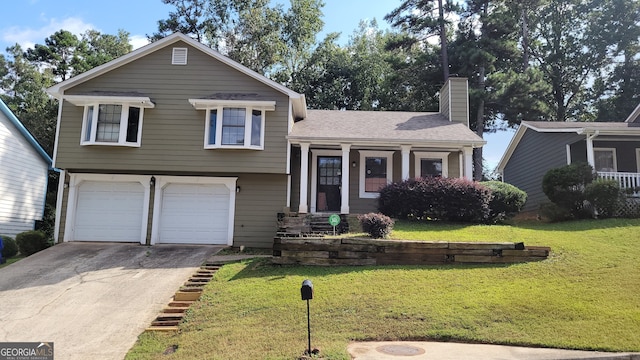 tri-level home with a garage and a front lawn