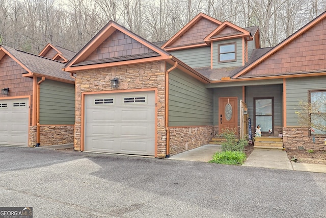 craftsman house with a garage