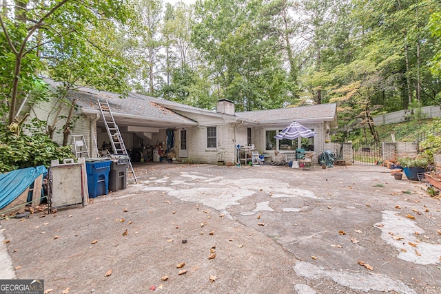 back of property with a patio