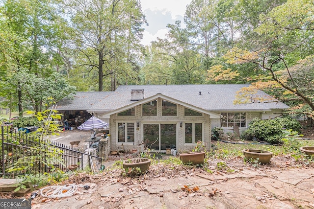 back of property with a patio