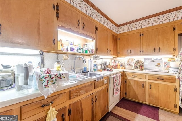 kitchen featuring light hardwood / wood-style floors, ornamental molding, sink, and white dishwasher