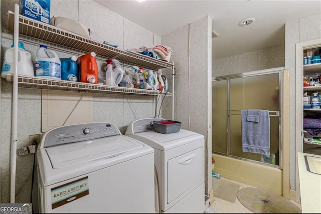 laundry room featuring washing machine and clothes dryer