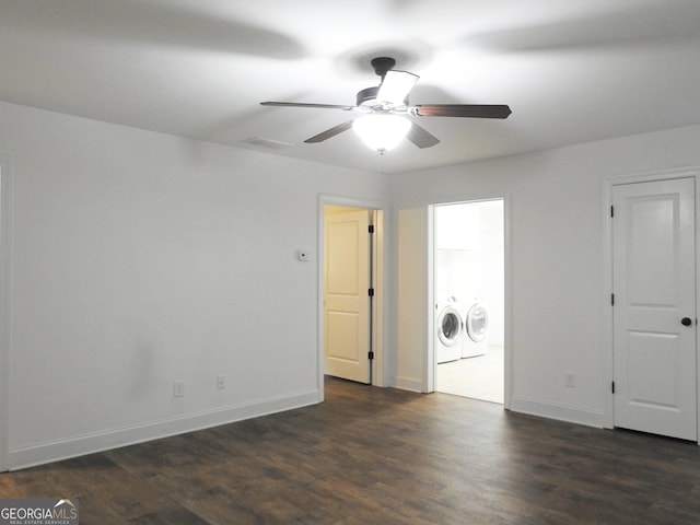 interior space with dark hardwood / wood-style flooring, washer and dryer, and ceiling fan