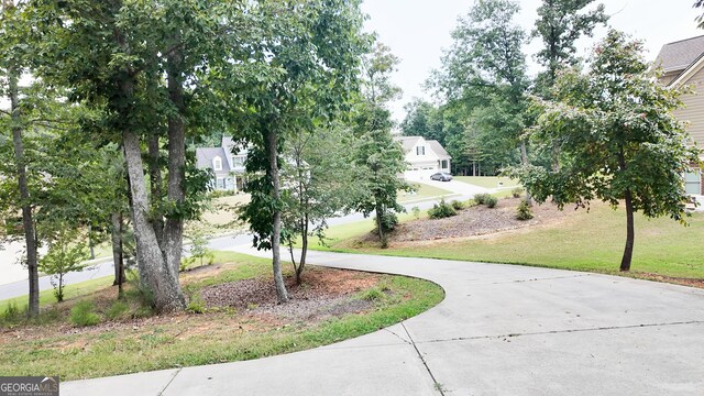 view of home's community with a lawn