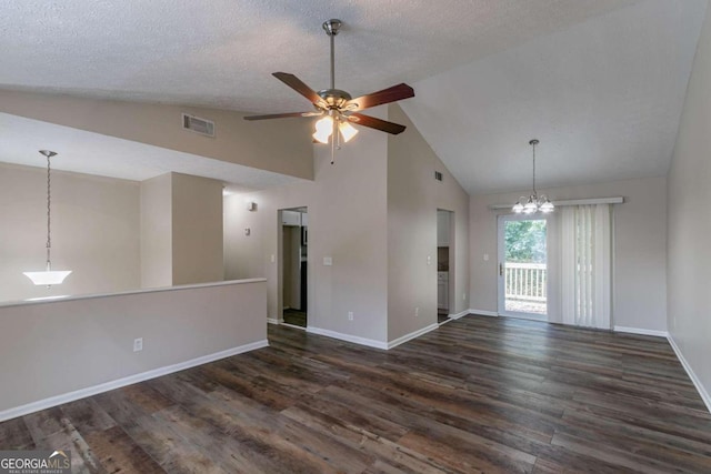 empty room with a textured ceiling, ceiling fan with notable chandelier, dark hardwood / wood-style floors, and high vaulted ceiling