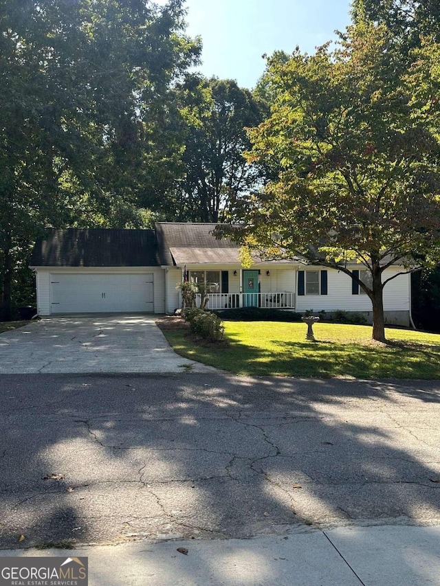 view of front of home featuring a garage and a front lawn