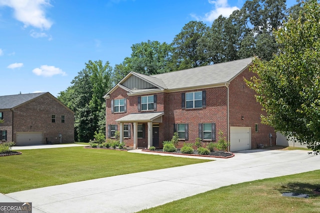 view of front of property featuring a front yard and a garage