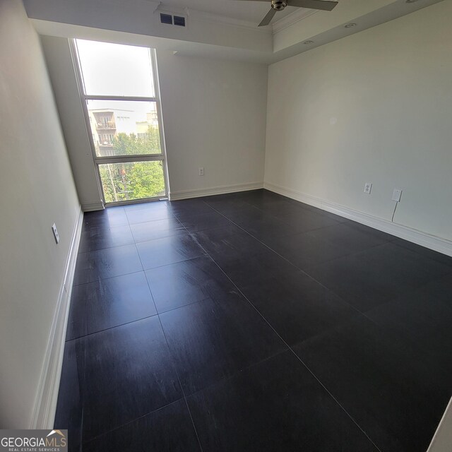 375 Ralph Mcgill Blvd Unit 505, Atlanta, GA 30312 - empty room featuring a ceiling fan and baseboards