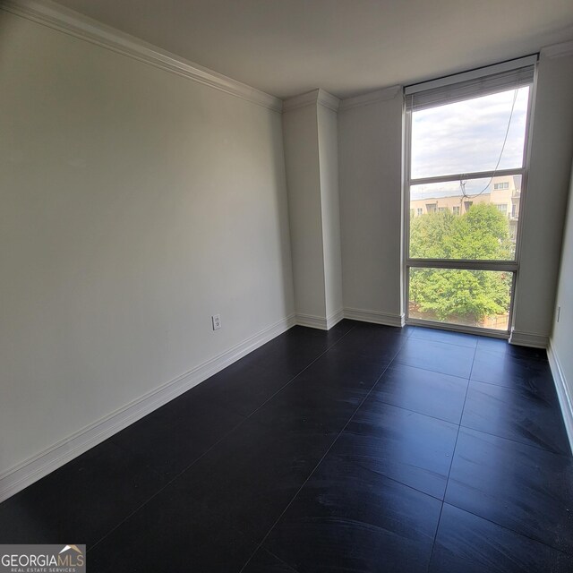 375 Ralph Mcgill Blvd Unit 505, Atlanta, GA 30312 - unfurnished room featuring crown molding and a wall of windows