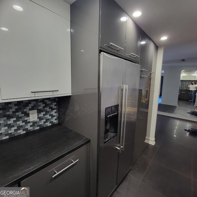 375 Ralph Mcgill Blvd Unit 505, Atlanta, GA 30312 - kitchen with dark countertops, high end refrigerator, dark tile patterned floors, backsplash, and recessed lighting