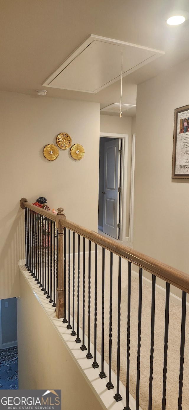 hallway featuring carpet