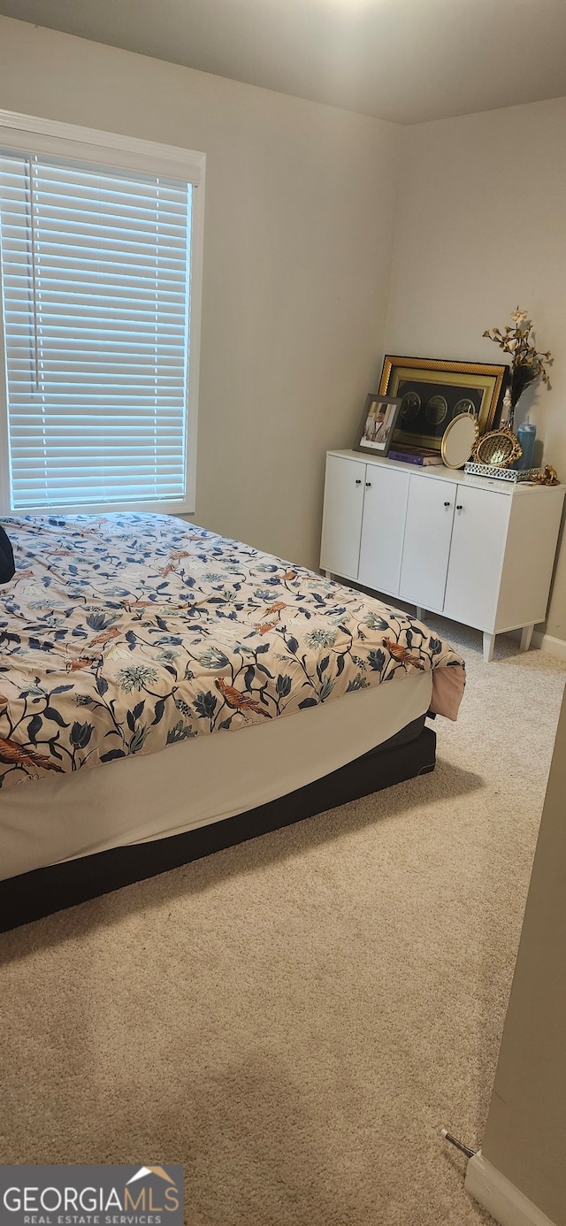 unfurnished bedroom featuring carpet flooring