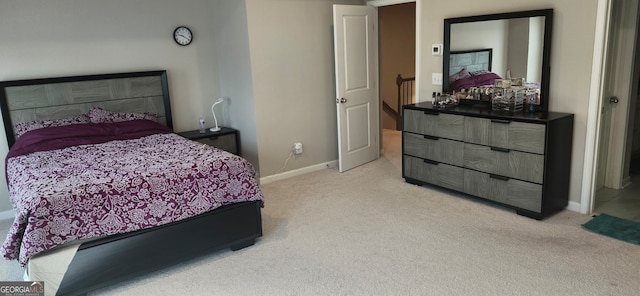 bedroom featuring light carpet