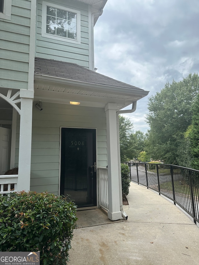 view of exterior entry featuring a porch