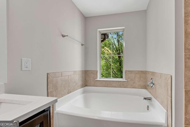 bathroom featuring vanity and a bathing tub