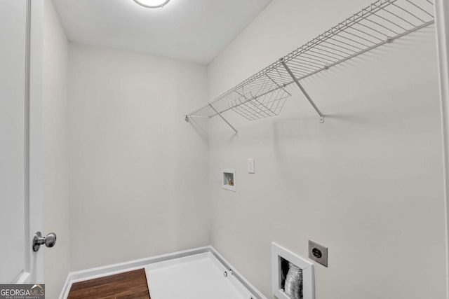 laundry area featuring hookup for a washing machine, wood-type flooring, and electric dryer hookup