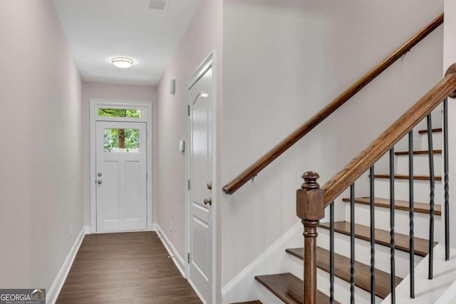 foyer with dark hardwood / wood-style floors