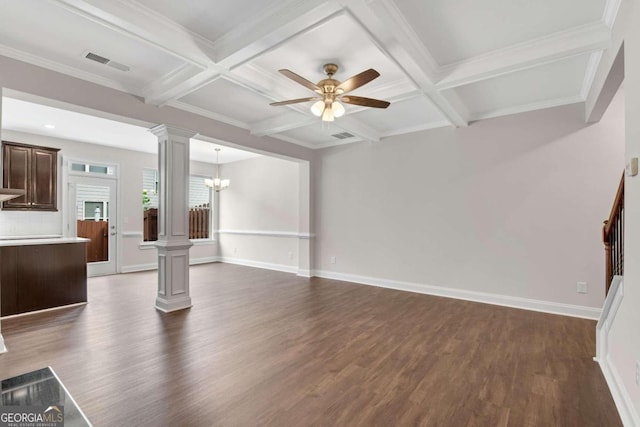 unfurnished living room with beamed ceiling, ceiling fan with notable chandelier, dark hardwood / wood-style floors, and ornate columns