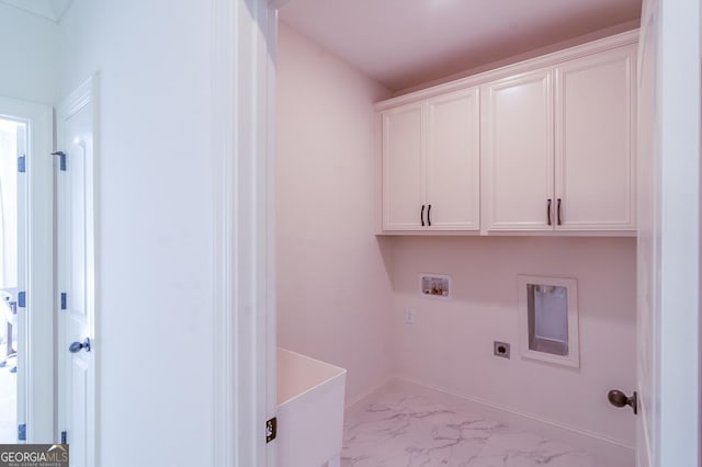 laundry area with cabinets, hookup for an electric dryer, and washer hookup