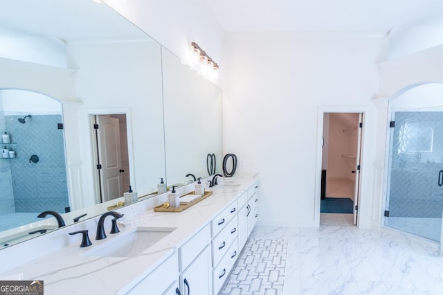 bathroom with walk in shower and vanity