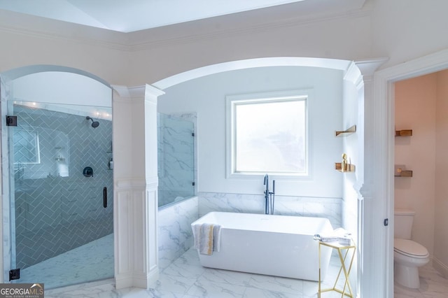 bathroom with ornate columns, plus walk in shower, crown molding, and toilet