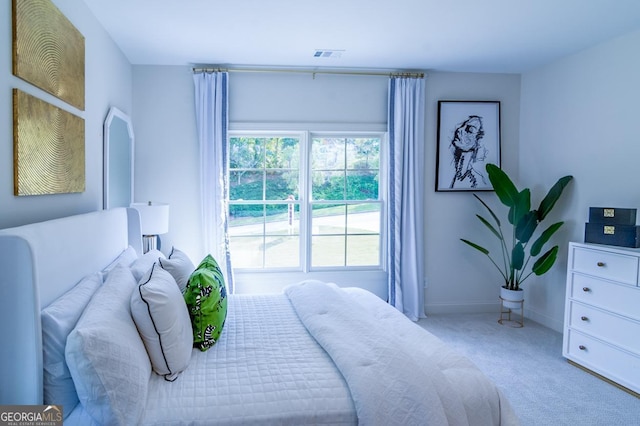 bedroom featuring light colored carpet