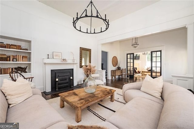 living room featuring a notable chandelier and hardwood / wood-style flooring