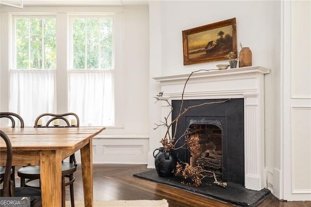 interior space featuring dark parquet flooring