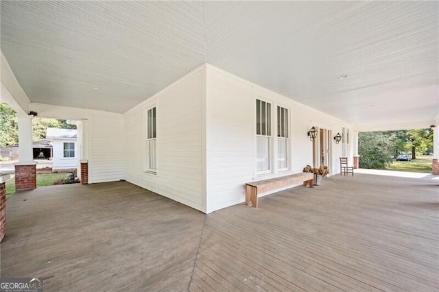 wooden terrace featuring a porch