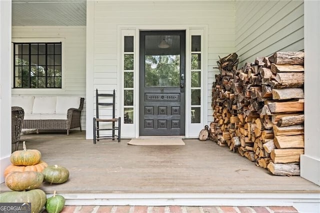 doorway to property with a porch