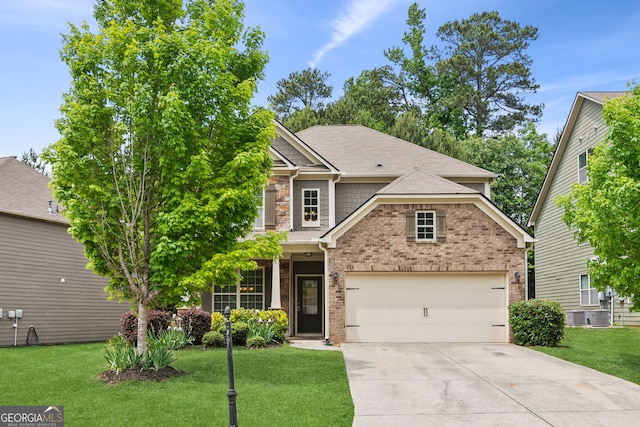 craftsman house with a front yard, a garage, and central air condition unit