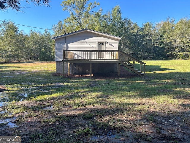 exterior space with a deck and a yard