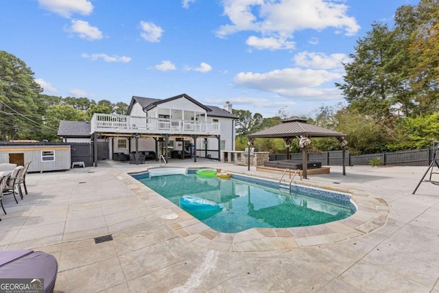 view of pool with a gazebo, a patio area, and a deck