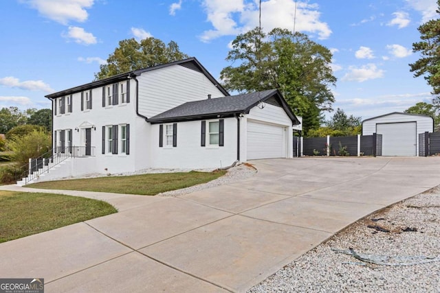 view of property exterior with a lawn and an outdoor structure