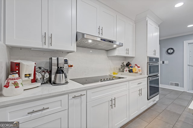 kitchen with tasteful backsplash, light stone counters, black electric cooktop, crown molding, and white cabinetry