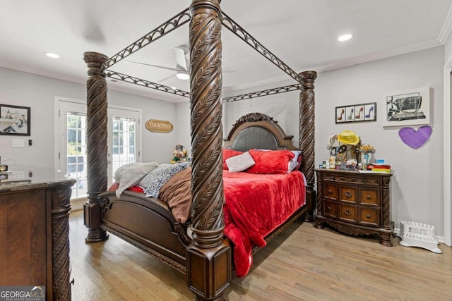 bedroom featuring light hardwood / wood-style floors, access to exterior, and crown molding