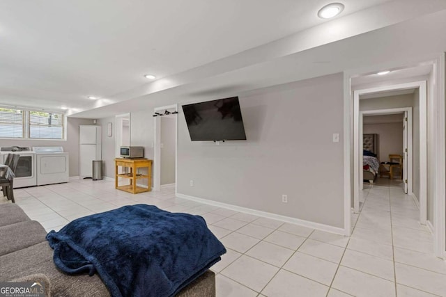 tiled living room with washer and dryer