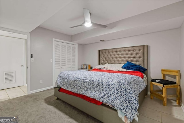 bedroom featuring carpet, ceiling fan, and a closet