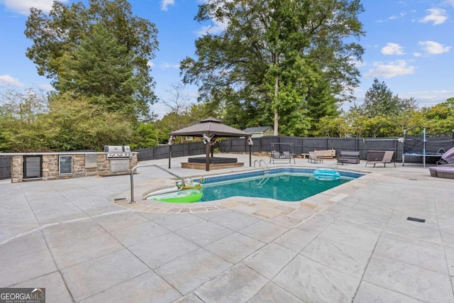 view of pool featuring a gazebo, a trampoline, and a patio