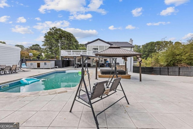 view of pool featuring a gazebo and a patio